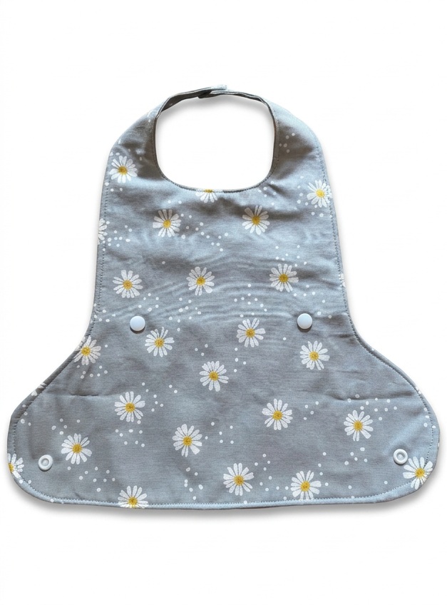 Grey Daisies bib laid flat on a white background